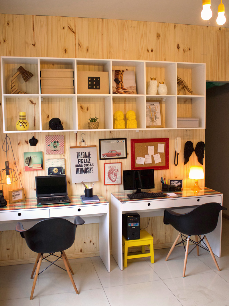 Office with wood wall and shelves